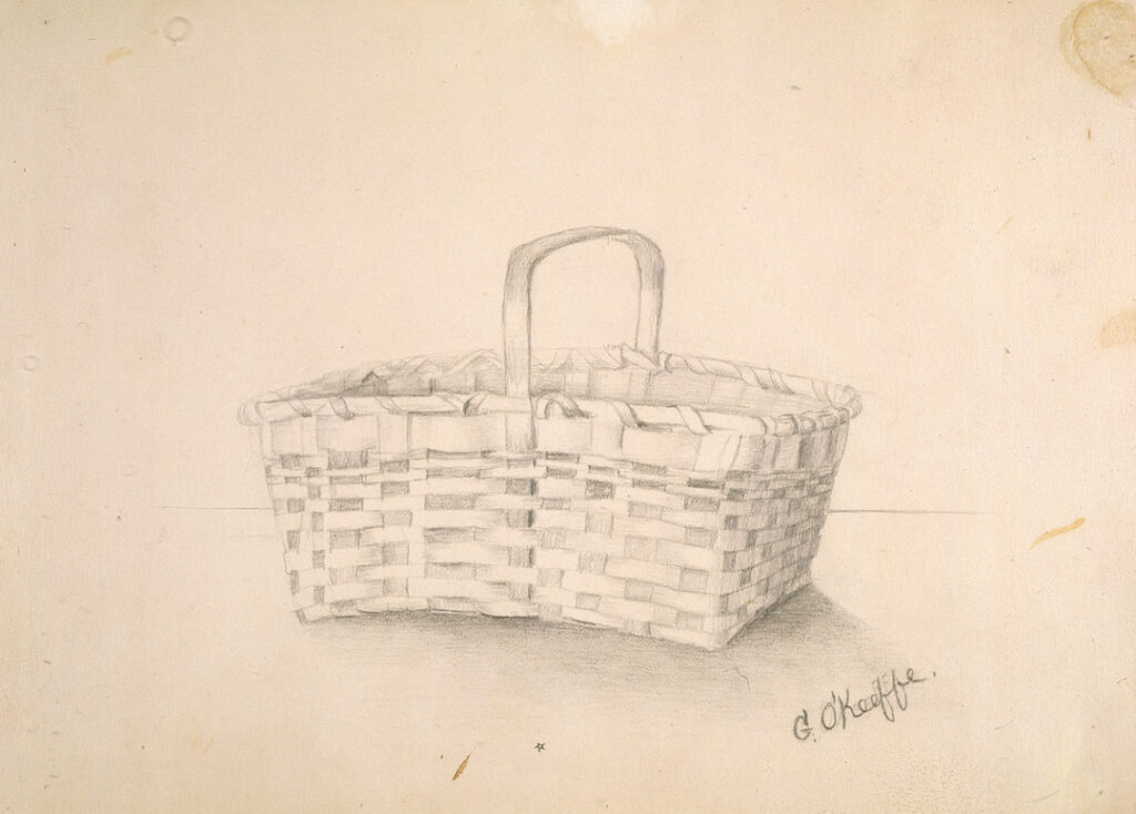In the center of the paper, light graphite drawing of a square basket with handle.