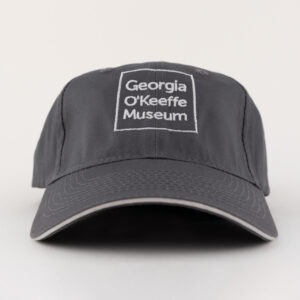 Black ball cap with a square Georgia O'Keeffe Museum logo.
