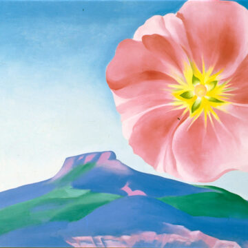 An enlarged, bright pink hollyhock with a yellow center occupies the upper right corner of the work. The flower hovers over a landscape that features a blue, pink, and green rendering of Pedernal below a vast blue sky.