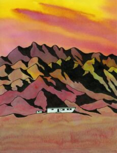 A graphic image in warm tones of layers of pointy mountains against an orange and yellow sky. Set one third above the bottom is a dwelling in the distance at the foot of the mountains.