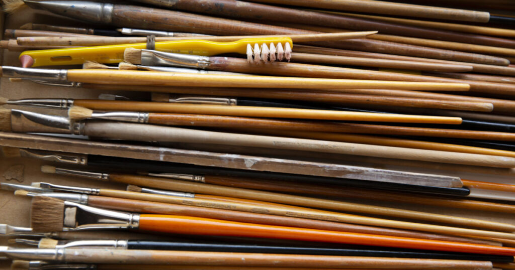 Upclose photo of paint brushes.