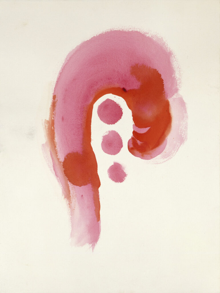 A pink upside-down hook in the center of the paper with three red circles, decreasing in size and in a horizontal row, inside of the hook.