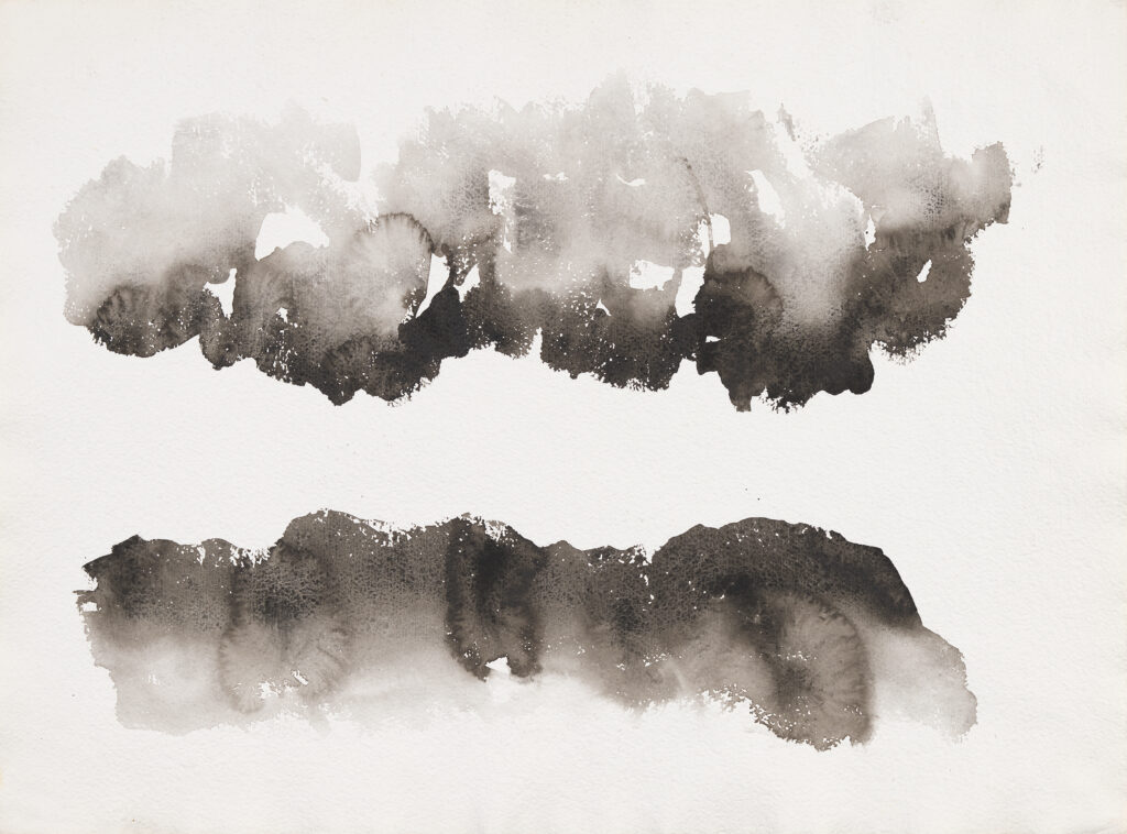 Two horizontal, blotchy black lines,separated by blank space, and suspended on the page. Both lines are lighter as the black progresses to the edge of the paper. As the color in the lines progress toward the opposite line, the color darkens.
