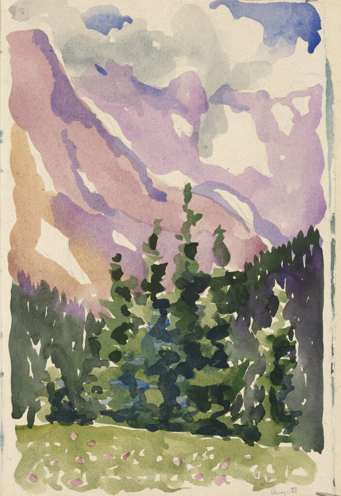 Green trees are in the bottom half of the paper. Purple and brown toned mountains dominate the background, upper half. A blue and white sky are in the upper quarter above the mountain.