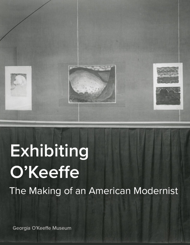 Photograph of the exhibition wall at 291 where three of O'Keeffe's watercolors paintings are displayed