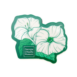 A magnet with an illustration of two large white flowers against a green background and leaves.
