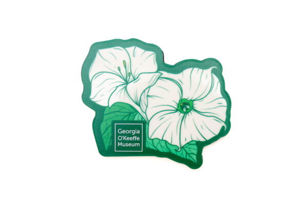 A magnet with an illustration of two large white flowers against a green background and leaves.