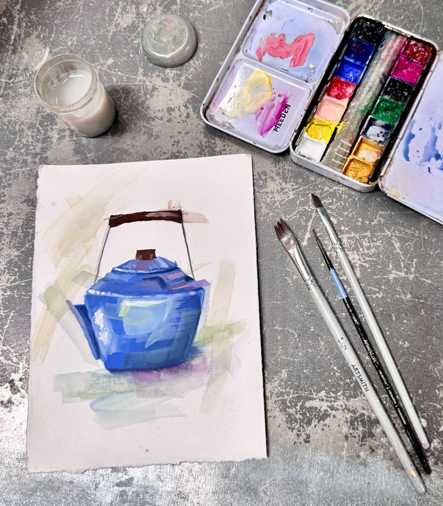 Photograph of a small painting of a blue tea kettle. Near the painting rests a colorful paint palette and some small brushes.