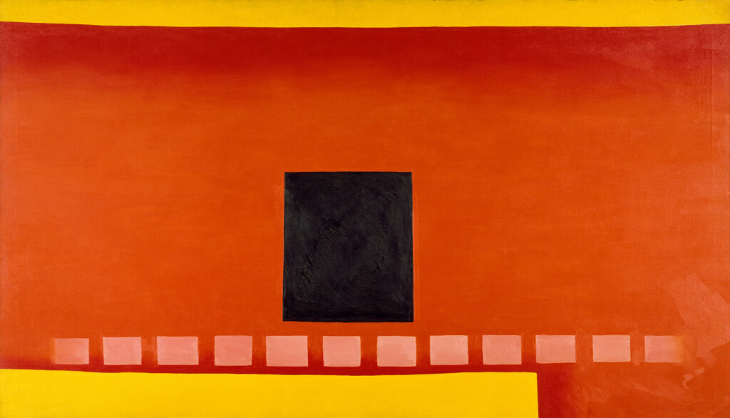 A wide, rectangular strip of red and orange fills the frame, with two thin strips of yellow above and below. A black square sits at the center of the composition. Below the square, small orange rectangles run across the composition. The composition depicts an adobe wall with a black door at its center and a path of square tiles running below it.