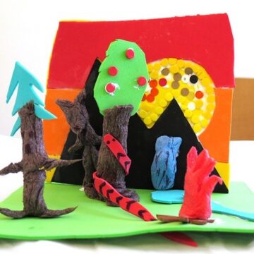 Colorful construction of different materials showing a landscape and trees made by a child.