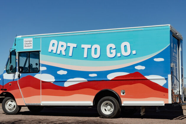 Image of a truck with mountain and cloud designs on it with the text 'Art to G.O.'