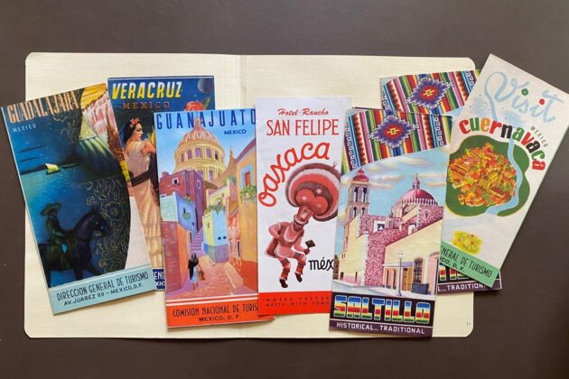 Photograph of seven rectangular brochures will colorful illustrations of sights and places in Mexico including Guadalajara, Vera Cruz, Guanajuato, San Felipe, Saltillo, and Cuernavaca.