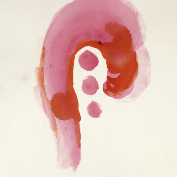 A pink upside-down hook in the center of the paper with three red circles, decreasing in size and in a horizontal row, inside of the hook.
